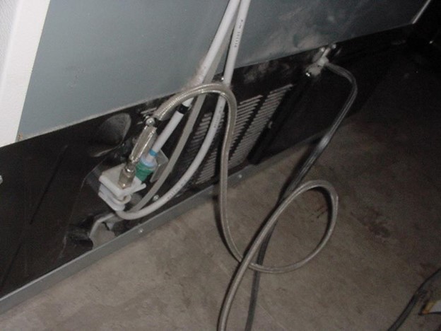 Repairing the refrigerator leaking water by repairing the water supply line